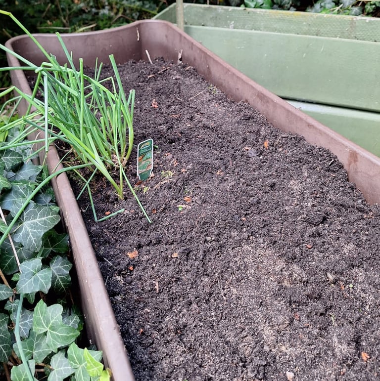 much brown dirt in a planter