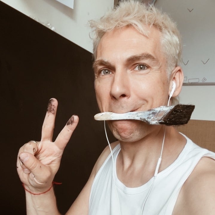 man holding brush in his mouth