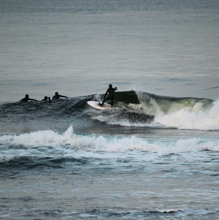 A surfer doing a top turn on a clean shoulder high wave