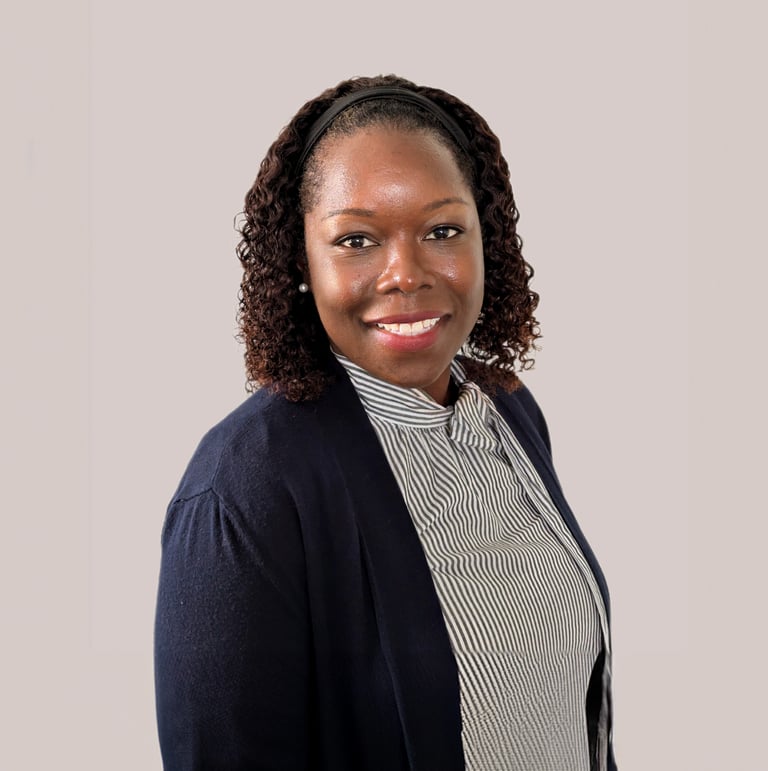 a woman in a black jacket and a white shirt