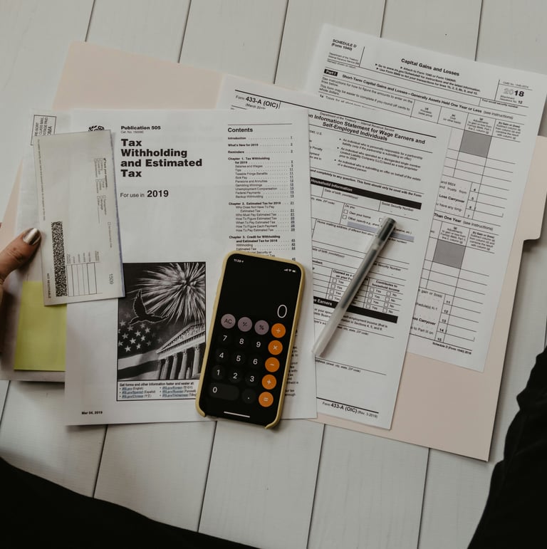 Tax papers with a calculator and pen