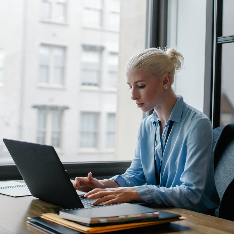 Young lady sitting in front of laptop