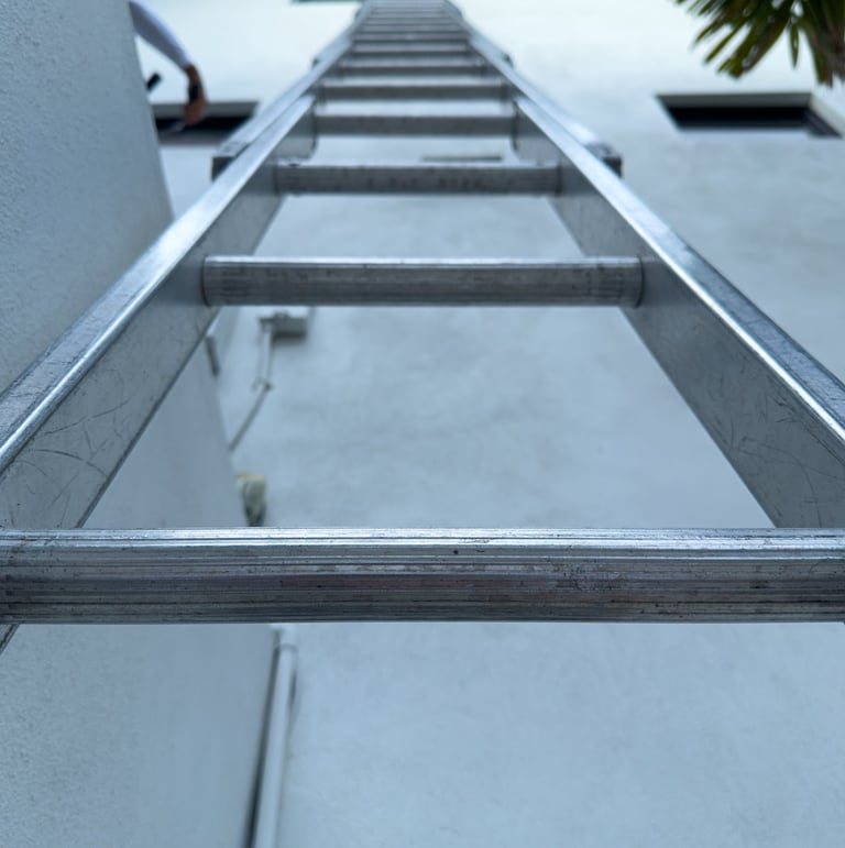 Multi-story window cleaning equipment safely reaching high windows on a Southwest Florida property.