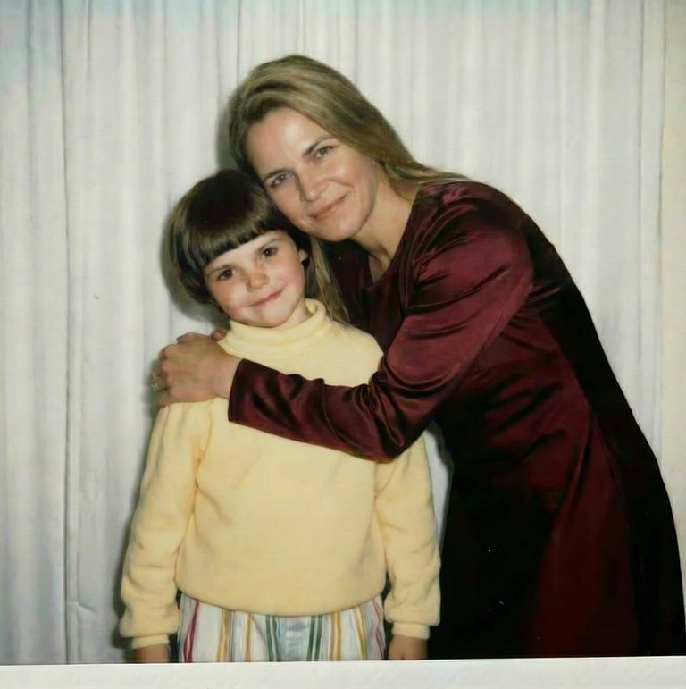 Adult Lucy hugging her childhood self