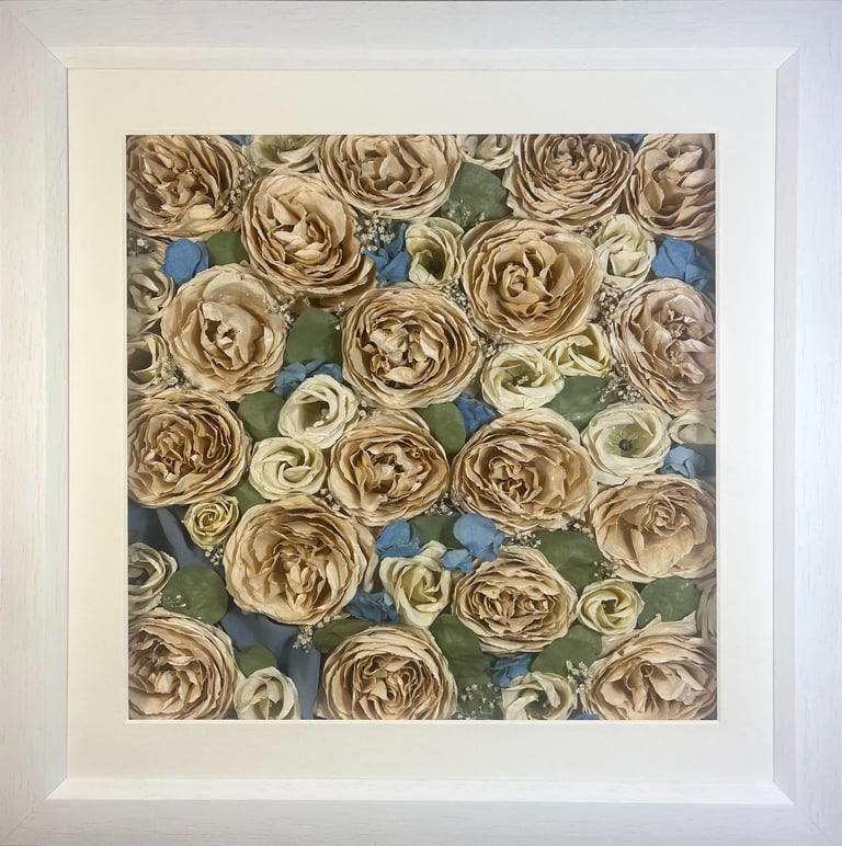 a simple flower wall style preserved wedding bouquet in a frame