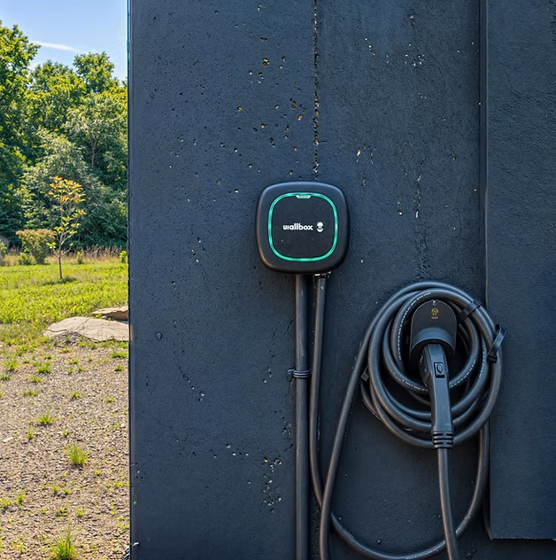 Complimentary level 2 EV charger for guests with electric vehicles.