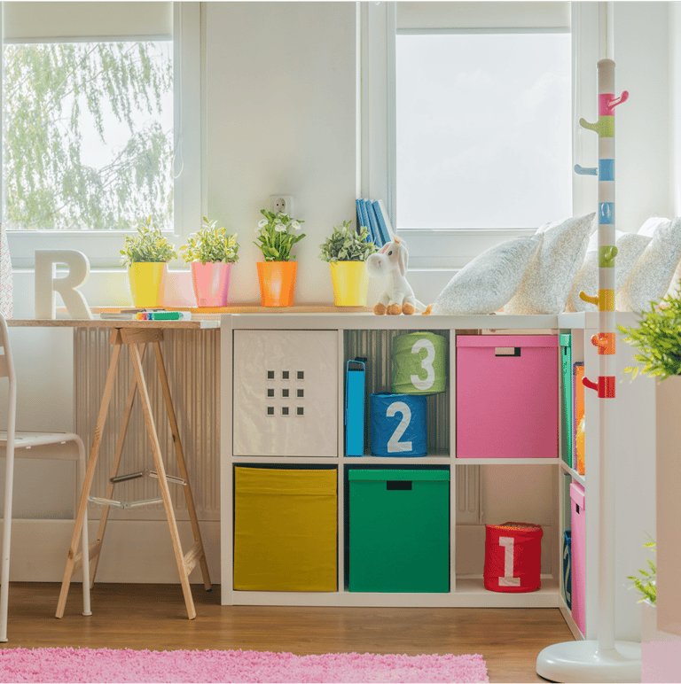 childs room with a desk with a chair and easy organiser