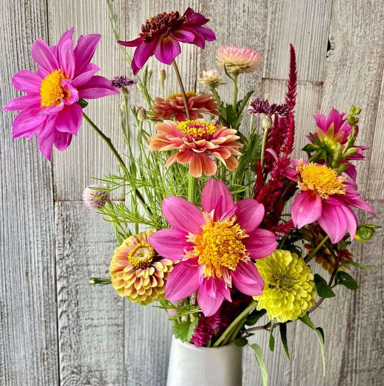 vase of flowers with pink dahlias, zinnias, celosia