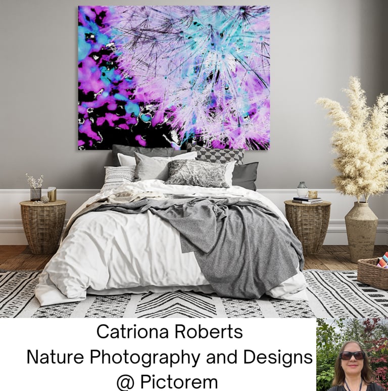 Canvas print on a wall above  bed.