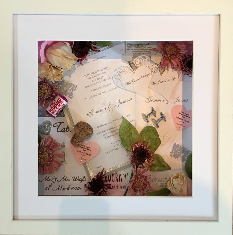 a Memory Box frame featuring wedding keepsakes and flowers