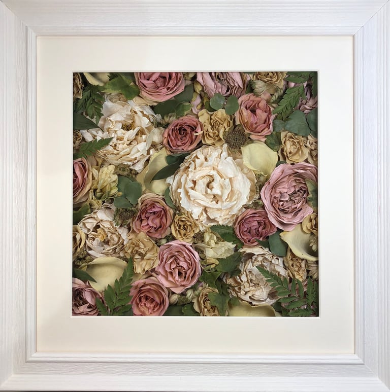 a Flower Wall Style bouquet of flowers in a ridged white frame