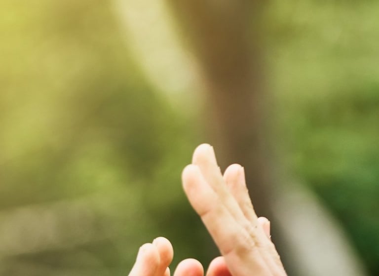 Group of people put their hands together in celebration