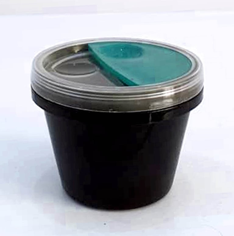 Final product of injection molded disposable sauce container, designed by Koorosh Shojaei, 1