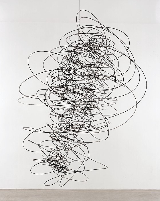 a large black and white sculpture os oscilation