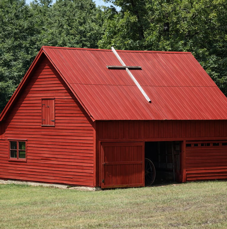 an old US barn restored with a rustic red barn color