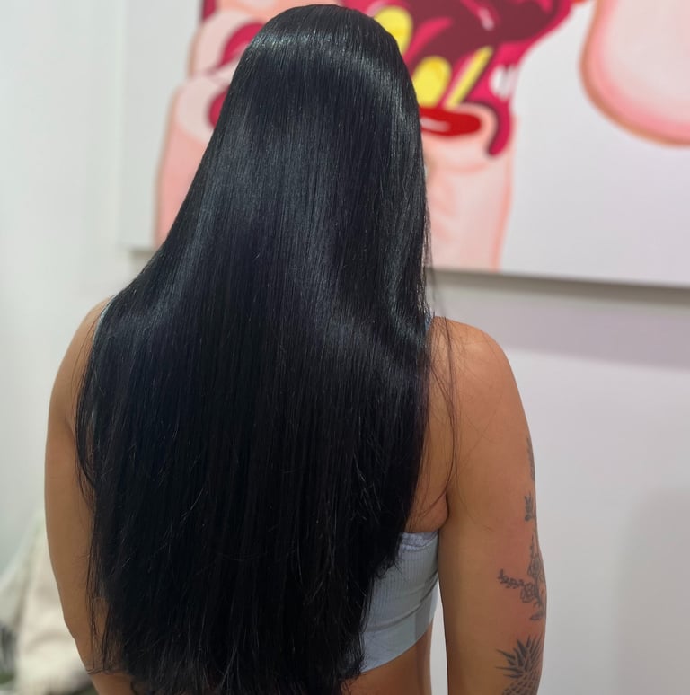 Long straight hair styled in Miami by Francis Hair & More for a sleek, natural look