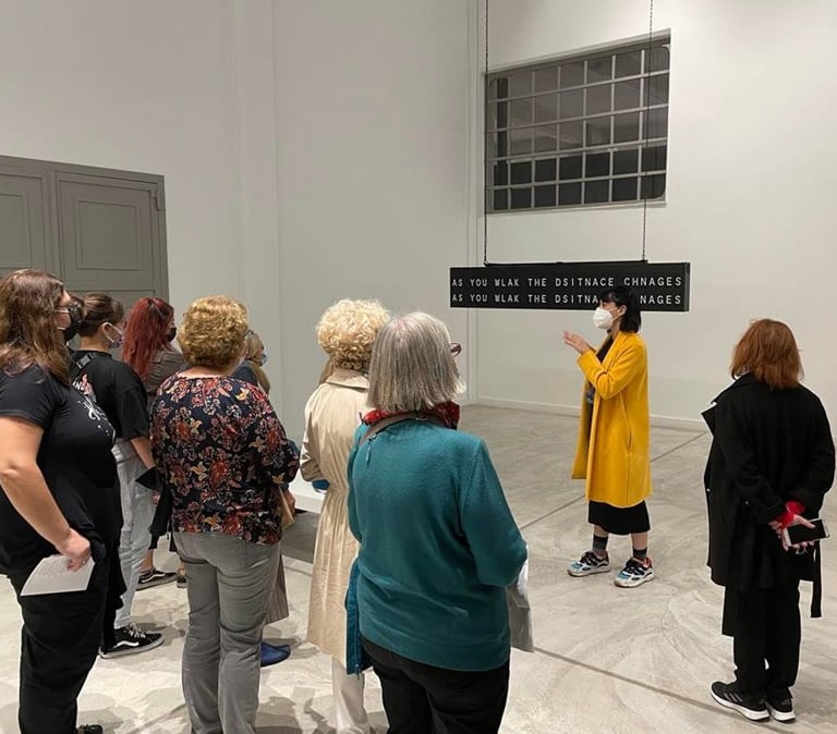 Asimina Georgakopoulou as art mediator on a guided tour of the Portals exhibition (NEON Organization