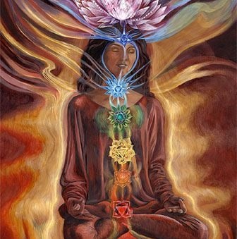 a woman sitting in a lotus flower meditation position