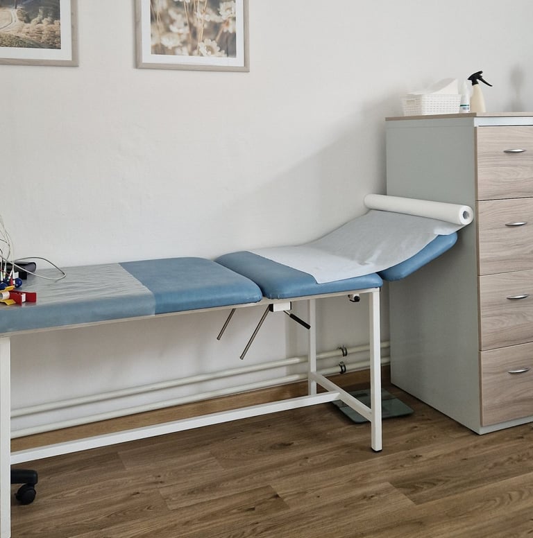 a hospital room with a bed and a desk