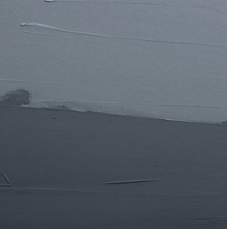 Macro photography of an artistic surface showing subtle transitions of grey and dark grey paint, emphasizing a minimalist and serene mood in a European context.