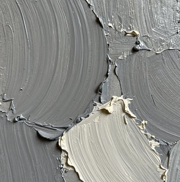 A close-up, macro photograph focusing on the heavy texture and impasto brushwork of an oil painting. The palette includes shades of medium grey and off-white. Soft, natural light highlights the depth and ridges of the paint layers on the canvas.