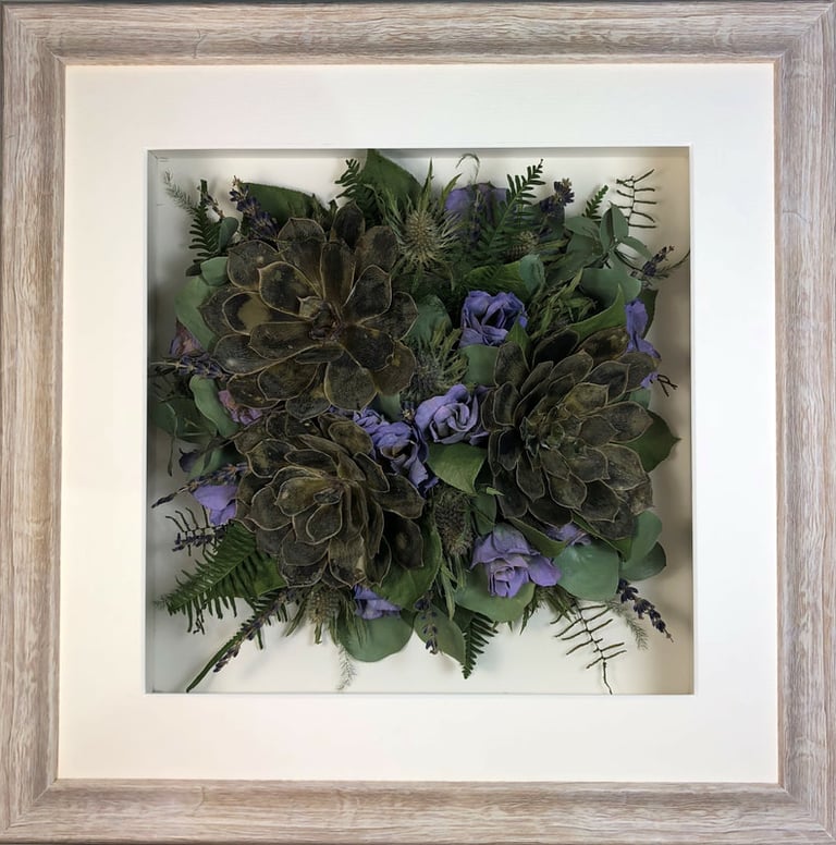 Gorgeous succulents and stems in a Birdseye view preserved wedding bouquet in a frame