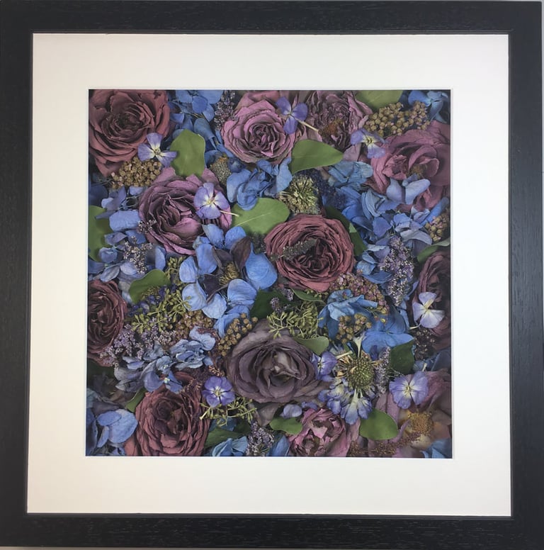 a Flower Wall Style bouquet of flowers in a thin black frame