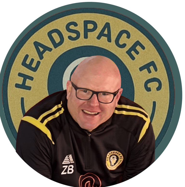 Smiling man in sports apparel with glasses in front of the Headspace FC logo.