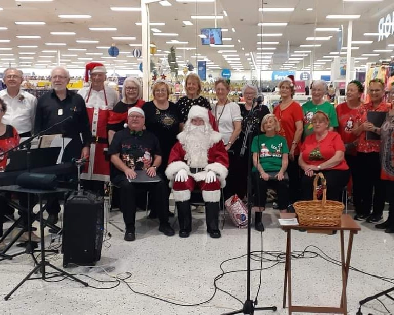 The District Singers perform at Menai Central