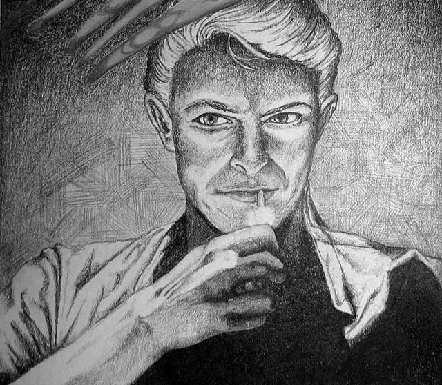 black and white image of David Bowie lighting a cigarette