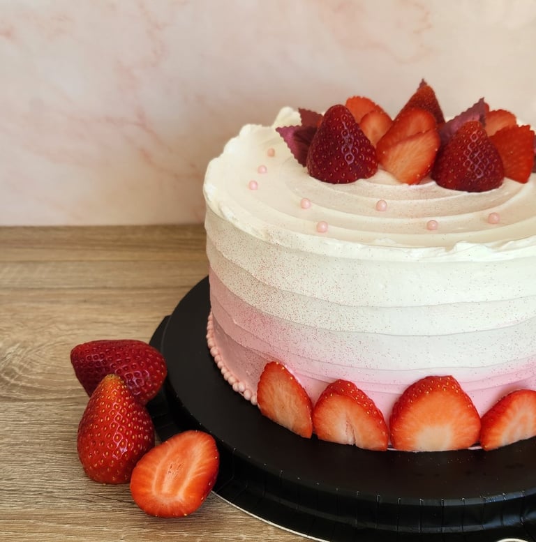 a cake with strawberries and strawberries on a table