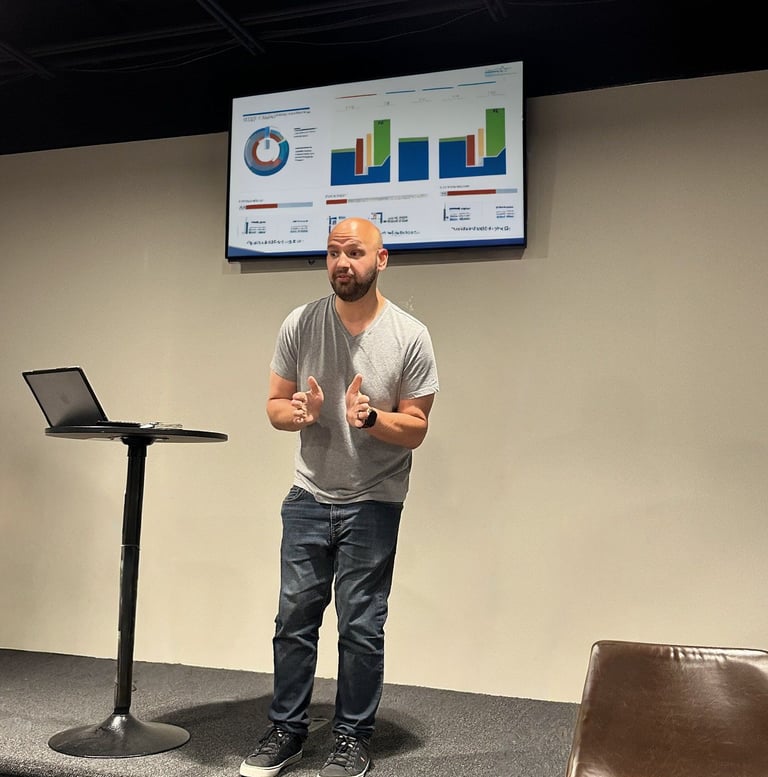 Dave Brock presenting IT and operations data at Rock of Grace, supporting small team systems and tech strategy.