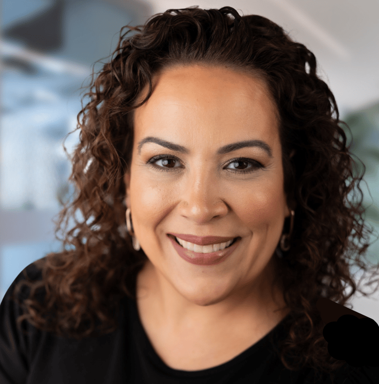 a woman with curly hair and a black shirt