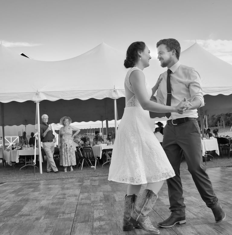 a bride and groom dancing in the outdoor wedding