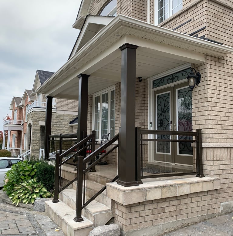  front porch with brown collumns improve the look of the house