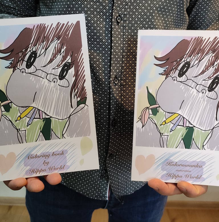 a man holding two books with a drawing of a girl