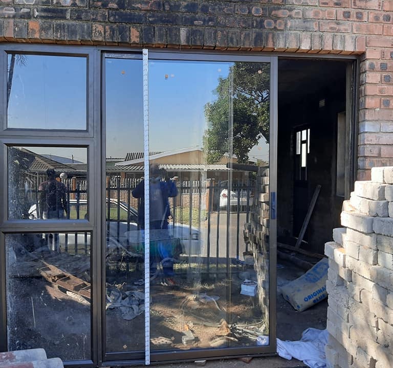 bronze aluminium door with sidelight and clear 6.38 shatterproof glass