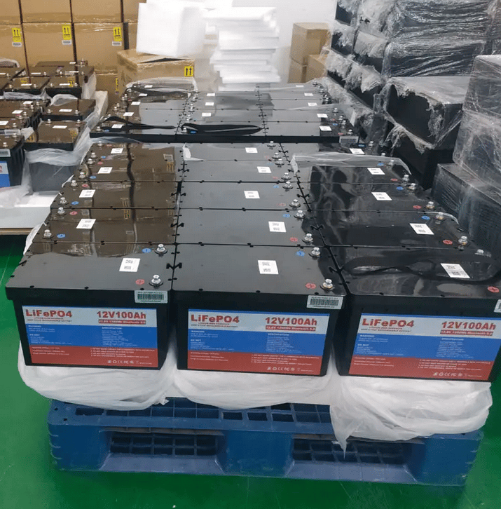 multiple 12 volt 100Ah lithium batteries stacked together in the manufacturing plant