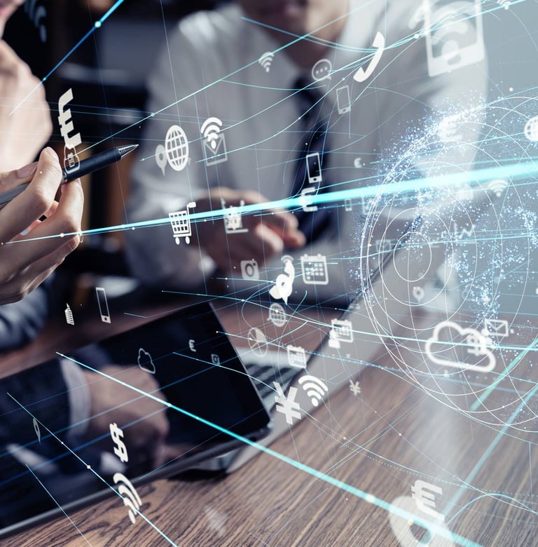 A man and a woman sitting with holograms of networks