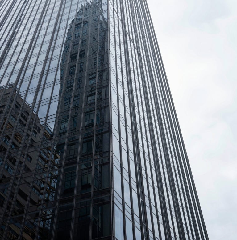 An abstract perspective of a skyscraper's glass corner against a bright white sky. The reflections are sharp and dark gray, embodying a bold, futuristic look for a South American / Brazilian commercial development.