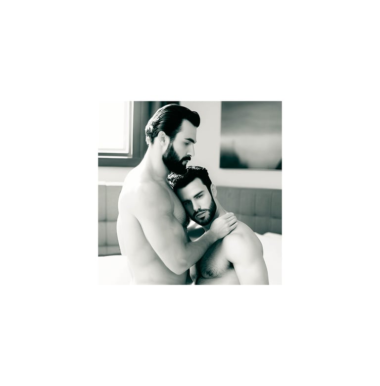 a man and man embracing in a bedroom