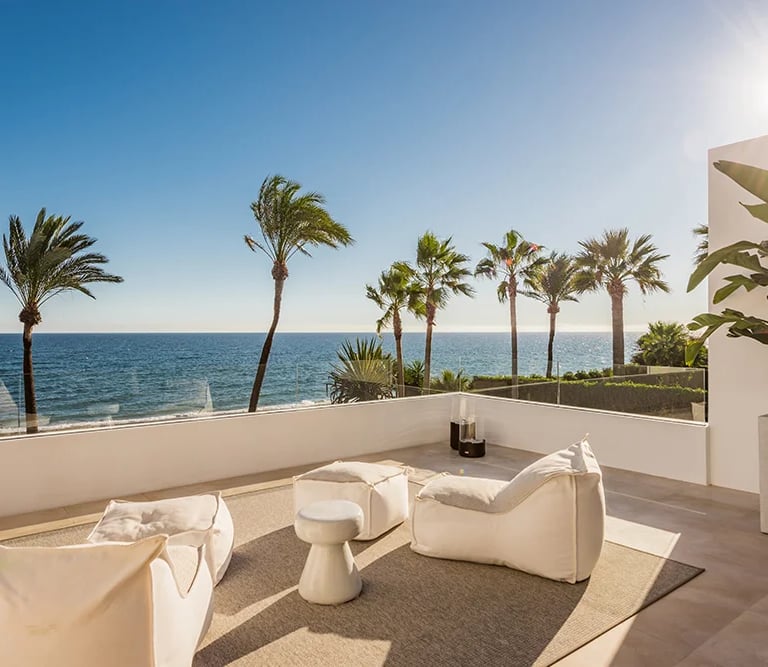 Upper terrace lounge with panoramic beachfront views