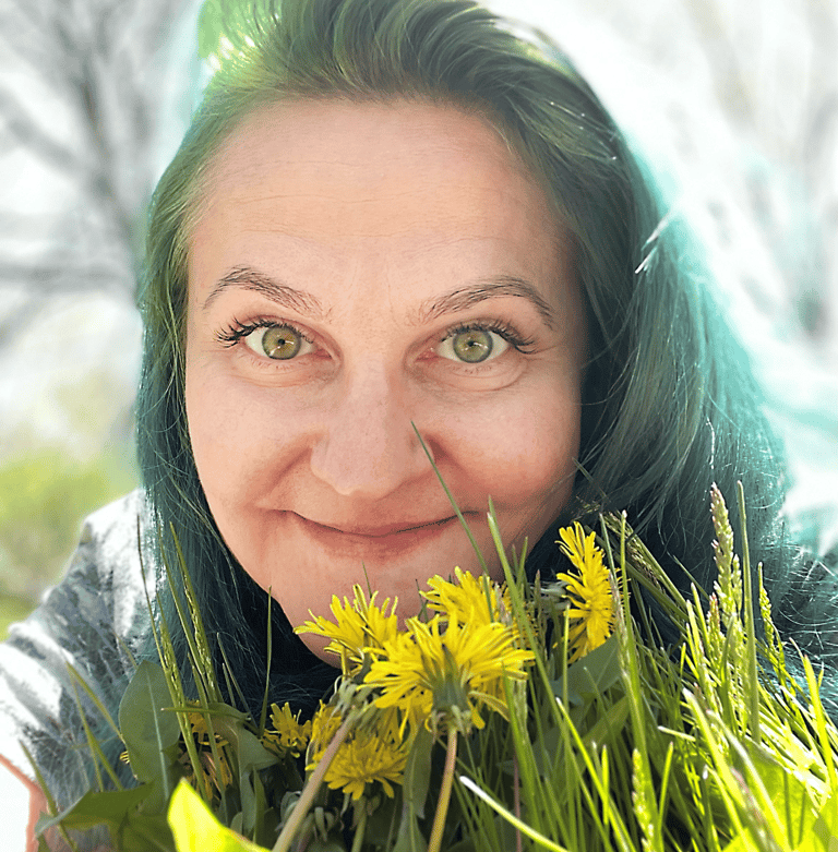 a woman with green hair and yellow flowers