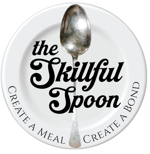 A silver spoon laying across a white plate the words, "The Skillful Spoon" written across the front