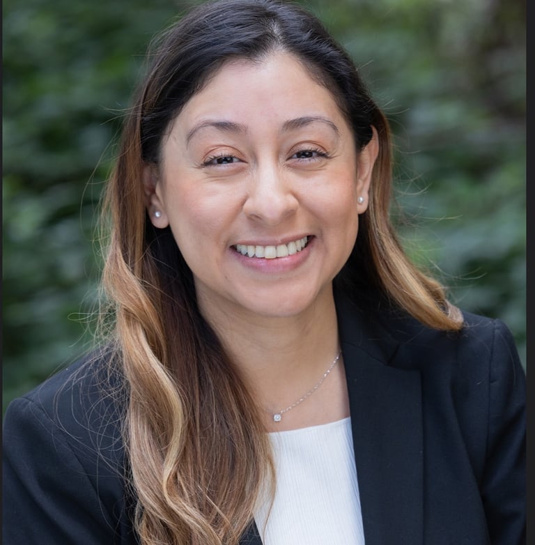a woman in a black suit and white shirt