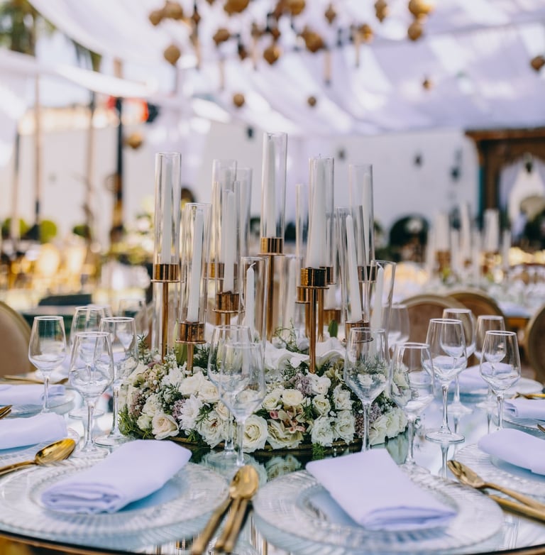 table decorated with flowers and candles