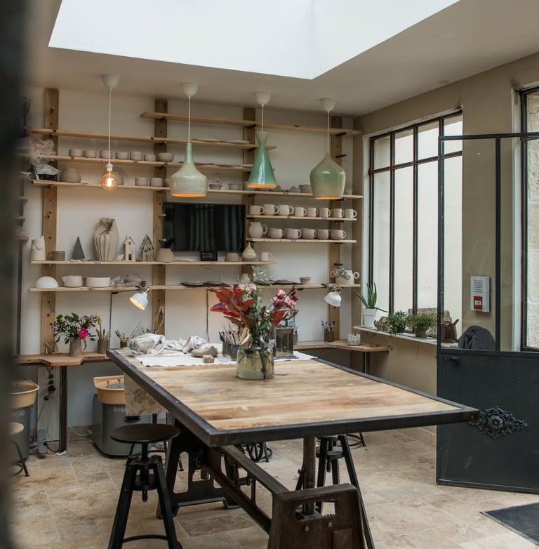 a table with a wooden table top and a skylight