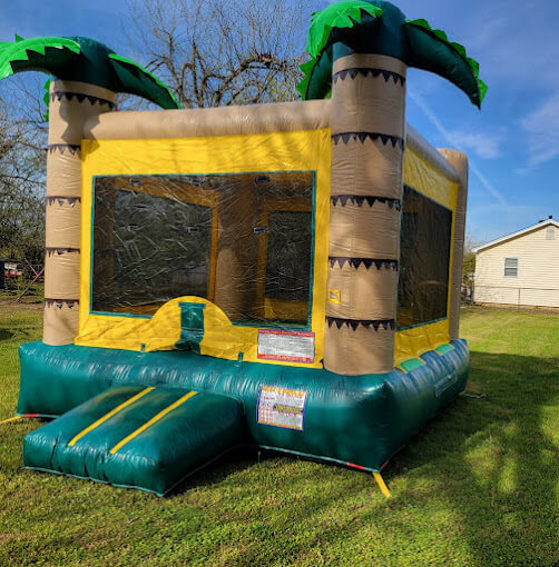 Tropical palm tree bounce house rental setup in Oklahoma City