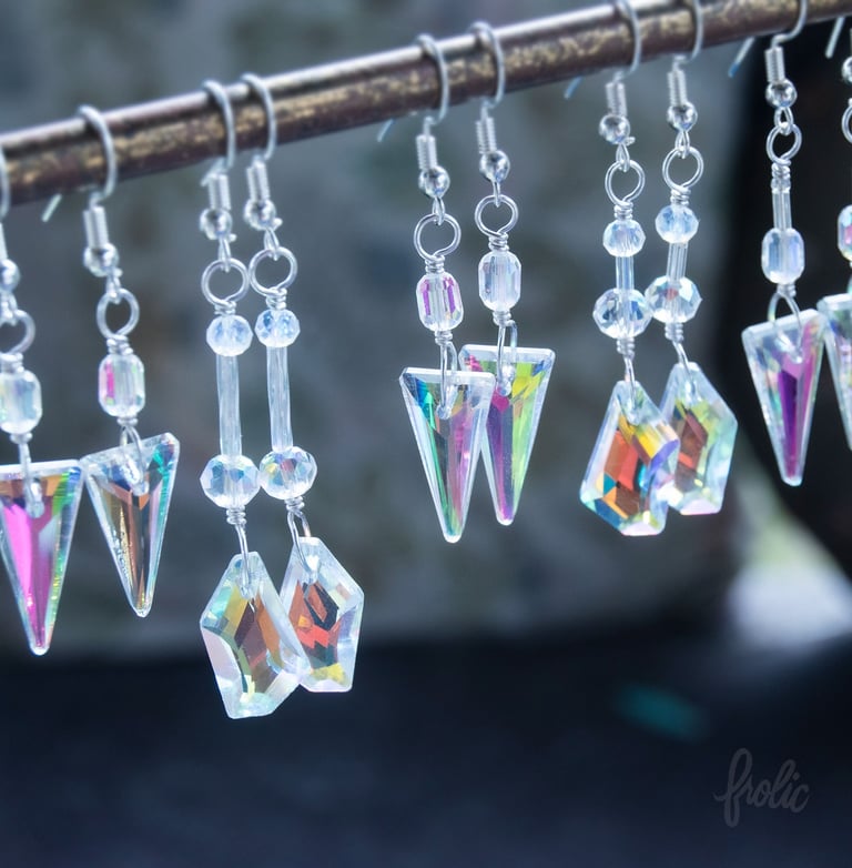 Glass prisms create rainbow effects on and near wearer. 