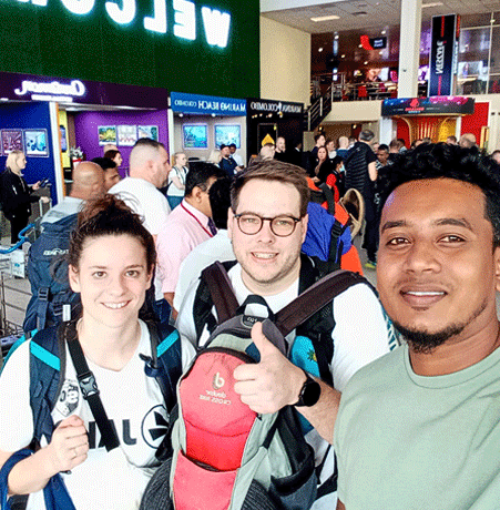 Two international tourists meeting their professional driver at Colombo Airport for a reliable Sri L